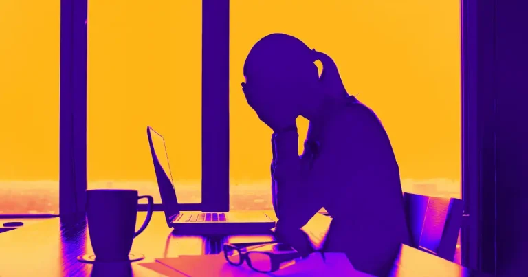 woman sitting worried at work